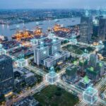 Futuristic city skyline overlay with digital blockchain connections illustrating blockchain applications 2025 in supply chain, finance, and healthcare industries.